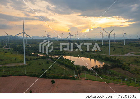 Aerial top view of wind turbines or windmills farm field with water in lake or river in industry factory. Power, sustainable green clean energy, and environment concept. Nature innovation. 78102532