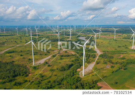 Aerial view of wind turbines or windmills farm field in industry factory. Power, sustainable green clean energy, and environment concept. Nature innovation. 78102534
