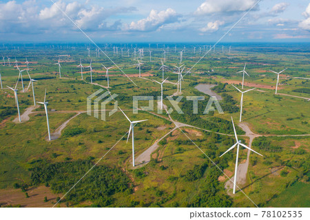 Aerial view of wind turbines or windmills farm field in industry factory. Power, sustainable green clean energy, and environment concept. Nature innovation. Aerial view of wind turbines or windmills farm field in industry factory. Power, sustainable green clean energy, and environment concept. Nature innovation. 78102535