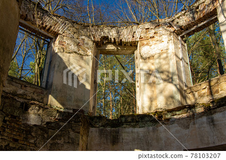 View through a holes for doors and windows in an abandoned ruin in the woods View through a holes for doors and windows in an abandoned ruin in the woods 78103207