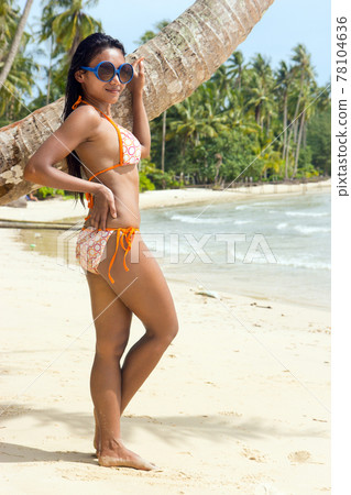 woman resting on the beach 78104636