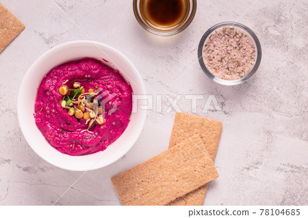 Roasted Beet Hummus in a bowl. Roasted Beet Hummus in a bowl. 78104685