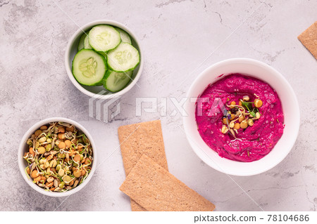 Roasted Beet Hummus in a bowl. Roasted Beet Hummus in a bowl. 78104686