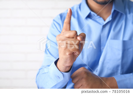 young man hand index finger pointing up. young man hand index finger pointing up. 78105016