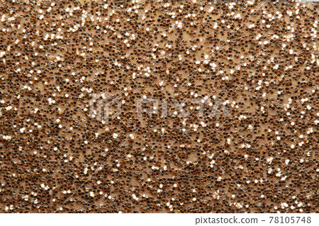 棕色背景點綴著閃閃發光的閃光 棕色背景點綴著閃閃發光的閃光 78105748