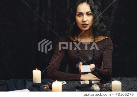 Portrait of fortune-teller in a dark room Portrait of fortune-teller in a dark room 78106276