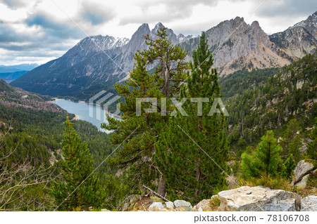 Top view of Els Encantats flowed in canyon in Estany de Sant Maurici in Espot in Spain Top view of Els Encantats flowed in canyon in Estany de Sant Maurici in Espot in Spain 78106708