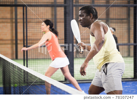 African american man playing paddle tennis African american man playing paddle tennis 78107247