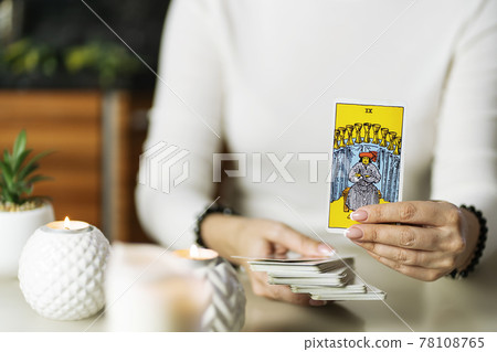 Fortune teller woman reading a future by tarot cards concept, nine of cups Fortune teller woman reading a future by tarot cards concept, nine of cups 78108765