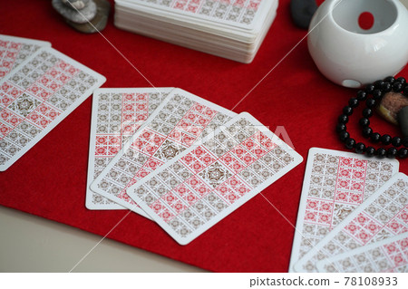 Defocused mystic ritual with tarot cards, and candles. Defocused mystic ritual with tarot cards, and candles. 78108933