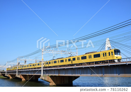 Keikyu 1000 series Yellow Happy Train crossing the Keisei Main Line Nakagawa Bridge 78110262