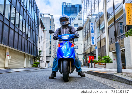 A man who commute by motorcycle Yokohama 78110587
