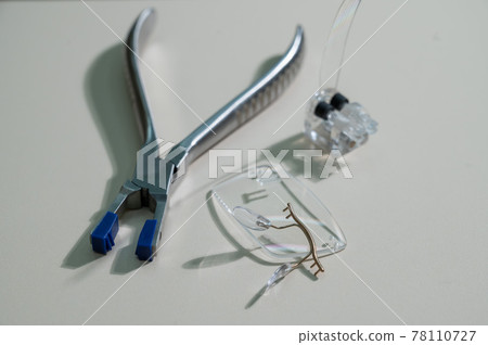Disassembled glasses and instruments by an ophthalmologist. Disassembled glasses and instruments by an ophthalmologist. 78110727