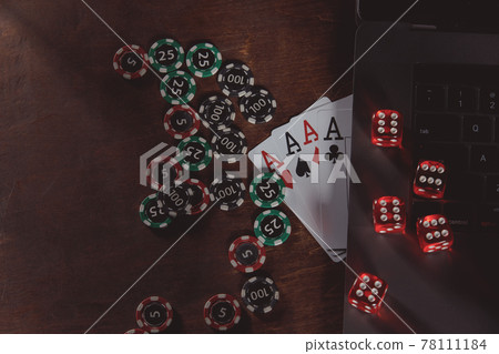 Playing chips, dices and cards on a wooden table 78111184