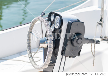 Close-up of a yacht steering wheel. Close-up of a yacht steering wheel. 78111263