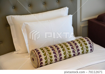 Hotel beds, pillows and cushions. 78112671