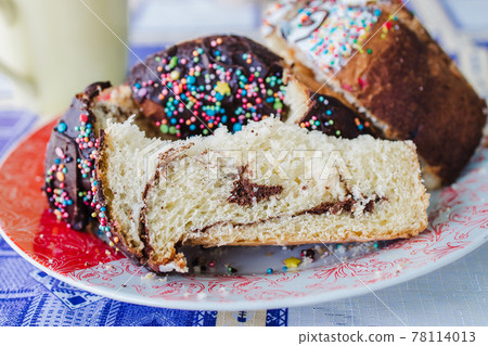 traditional Easter cake cut into chunks on a plate traditional Easter cake cut into chunks on a plate 78114013