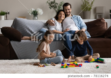 Happy family with kids relax at home on weekend 78116274