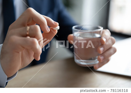 Manager, employee, worker taking pills, painkillers, antibiotics Manager, employee, worker taking pills, painkillers, antibiotics 78116318