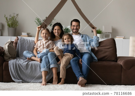 Portrait of happy family with kids in new home Portrait of happy family with kids in new home 78116686