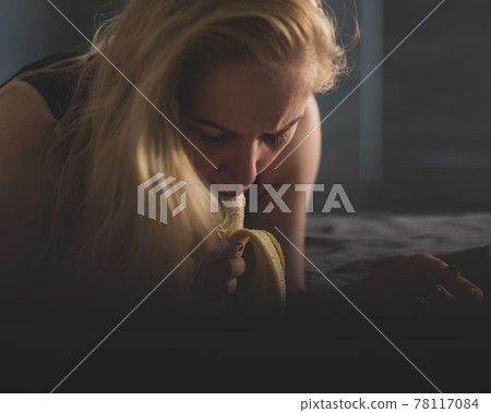 The blonde imitates oral sex and sucks a banana The blonde imitates oral sex and sucks a banana 78117084
