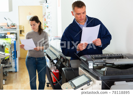 Printing company employees work on various printing machines Printing company employees work on various printing machines 78118895