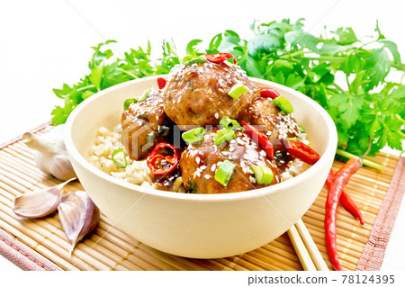 Meatballs in sweet and sour sauce with rice on wooden board Meatballs in sweet and sour sauce with rice on wooden board 78124395