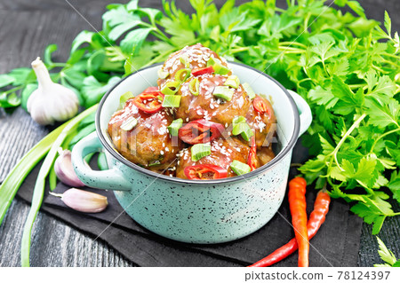 Meatballs in sweet and sour sauce on black board 78124397