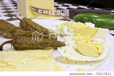 Boiled Eggs With Roasted Jalapeno Peppers and White Cheddar Cheese Boiled Eggs With Roasted Jalapeno Peppers and White Cheddar Cheese 78127611
