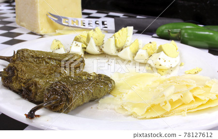 Boiled Eggs With Roasted Jalapeno Peppers and White Cheddar Cheese Boiled Eggs With Roasted Jalapeno Peppers and White Cheddar Cheese 78127612