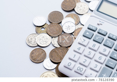 Calculator and coin 78128390