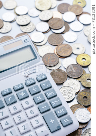 Calculator and coin 78128391
