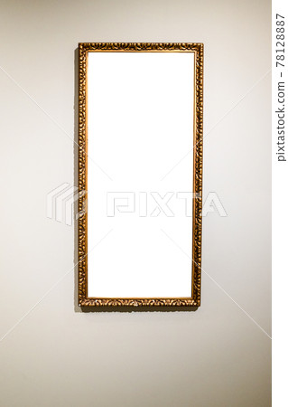 narrow tall picture frame on gray brown wall 78128887