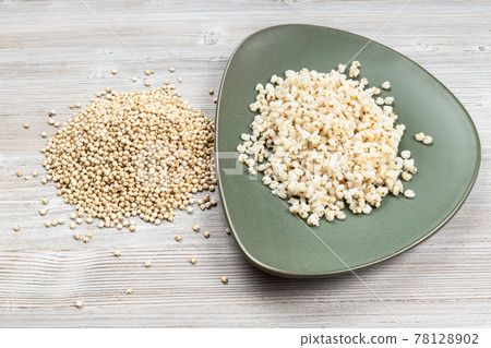 raw Sorghum grains and boiled porridge on plate raw Sorghum grains and boiled porridge on plate 78128902
