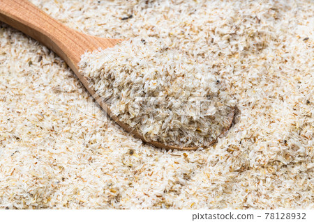 wooden spoon with psyllium husk close up on pile wooden spoon with psyllium husk close up on pile 78128932