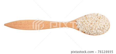 above view of psyllium husk in wood spoon isolated above view of psyllium husk in wood spoon isolated 78128935
