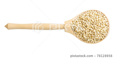 top view of polished Sorghum groats in wood spoon 78128938