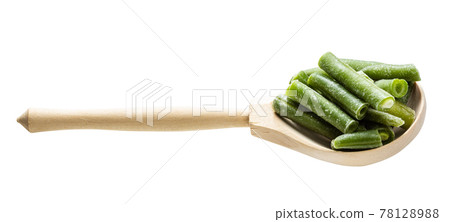 frozen green beans in wooden spoon isolated frozen green beans in wooden spoon isolated 78128988