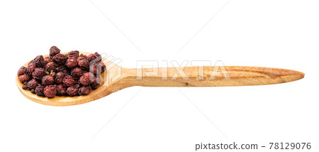 wooden spoon with dried schisandra fruits isolated 78129076