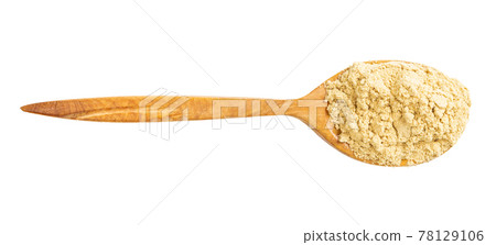 top view of wood spoon with ginger powder isolated top view of wood spoon with ginger powder isolated 78129106