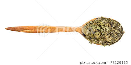 top view of spoon with ground leaves of basil top view of spoon with ground leaves of basil 78129115