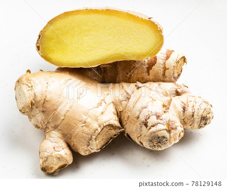 natural fresh whole and cut ginger roots on gray natural fresh whole and cut ginger roots on gray 78129148
