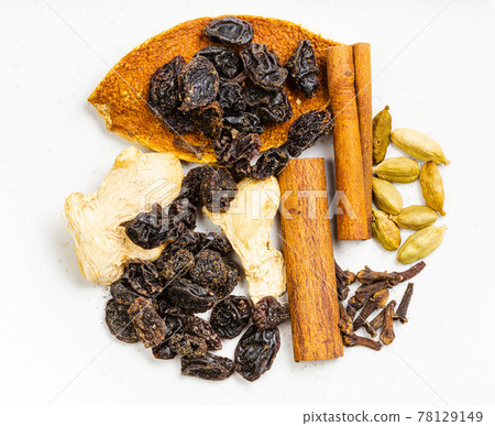 top view of dried Mulling spices on gray plate top view of dried Mulling spices on gray plate 78129149