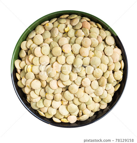 whole light green lentils in round bowl isolated 78129158