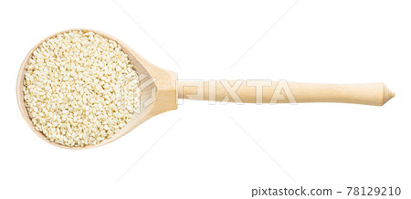 top view of wood spoon with white sesame seeds 78129210