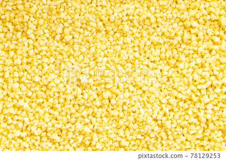 background - uncooked moroccan couscous groats 78129253