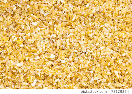 background - crushed polished wheat grains background - crushed polished wheat grains 78129254