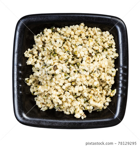 cores of hemp seeds in black bowl isolated cores of hemp seeds in black bowl isolated 78129295