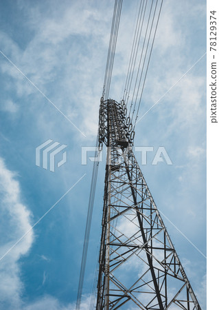 Power transmission tower looking up and clouds floating in the blue sky c-4 film style Power transmission tower looking up and clouds floating in the blue sky c-4 film style 78129374