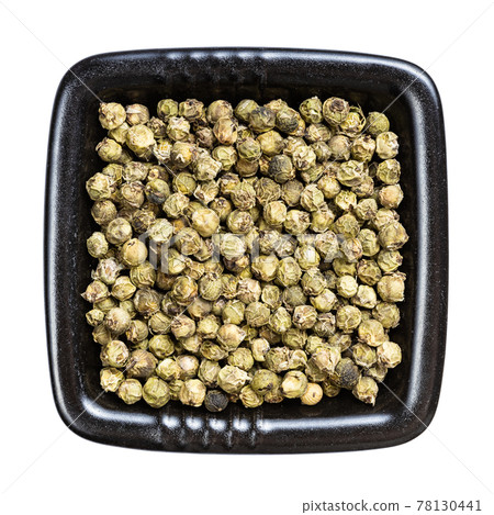 green pepper peppercorns in black bowl isolated 78130441